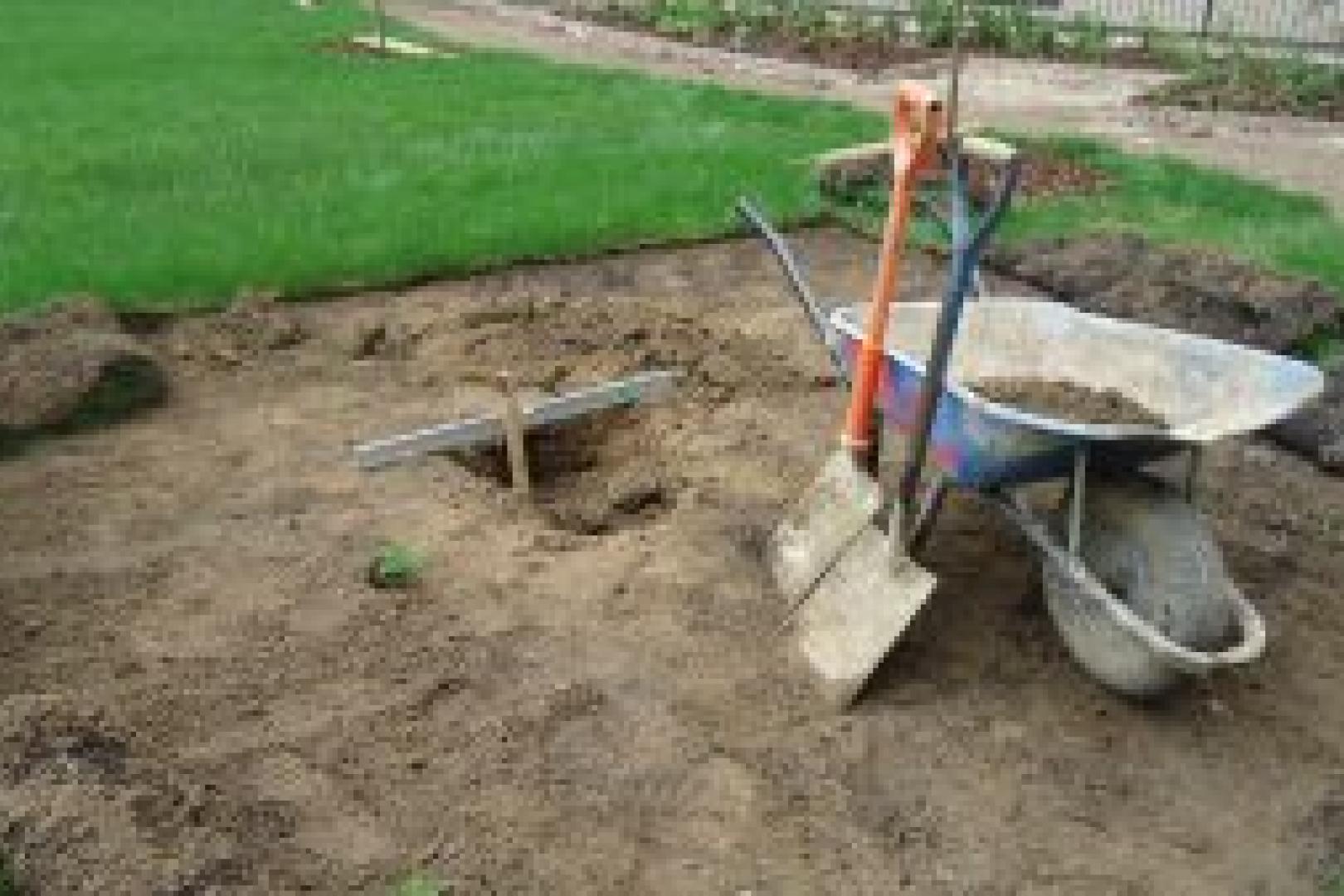 Wheel barrow and spades